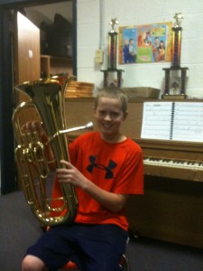 Student from Georgetown MS (MA) showing off a new instrument